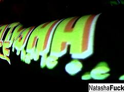 Busty Natasha Nice fingers her wet pussy in sexy black light solo