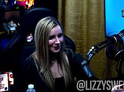 Lizzy sweet teases with her tits out