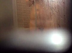 Teen girl caught masturbating her wet pussy in the shower
