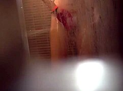 Teen girl caught masturbating her wet pussy in the shower