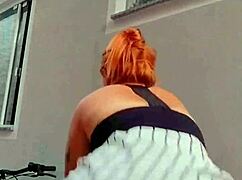 Sexy Redhead Cleans Window And Shows Off To Neighbor