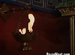 Mistress teases two slaves with strapon display