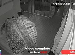 Security camera catches married woman and lover in hotel.