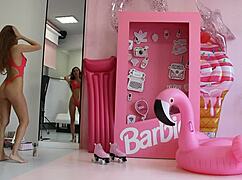 Barbie doll in red lingerie gets handled roughly