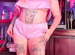 Curvy MILF teases in silk pajamas, showing off huge natural tits