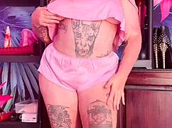 Curvy MILF teases in silk pajamas, showing off huge natural tits