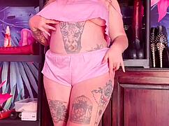 Curvy MILF teases in silk pajamas, showing off huge natural tits