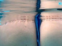 Sexy amateur teen caught fingering herself underwater in public pool.