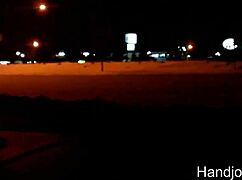 Milf gives midnight handjob leading to outdoor cumshot.