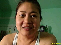 An amateur asian with big tits teases and blows on webcam.
