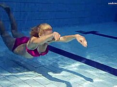 Elena Proklova, the beautiful Russian blonde, shows off underwater with natural tits