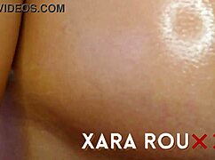 A latina woman explores her body in front of the mirror