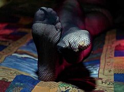 Perfect toes peeking through sexy fishnets on a milf housewife. She teases with nylon stockings and amateur fetish play.