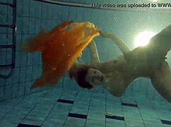 Nastya strips her clothes and shows naked hot body in the pool