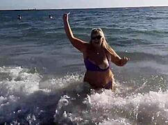 Hot MILF feels so horny masturbating on the beach