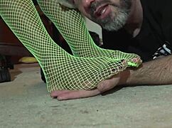 Worship my ebony feet in green fishnets for domination.