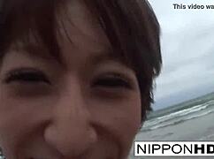 asian hottie blows her man at the beach