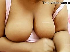 Asian aunty with big boobs seduces in a steamy family encounter. Her curves tell a wild story.