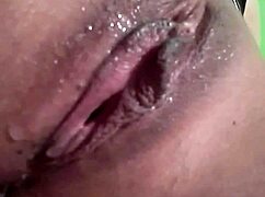 Groping my wet pussy with a dildo after a wild striptease.