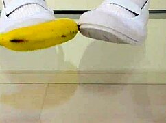 asian girl crushes banana in wild food fetish play