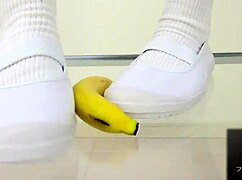 asian girl crushes banana in wild food fetish play
