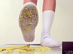 asian girl crushes banana in wild food fetish play