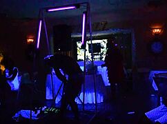 male stripper entertains milfs with glowing show