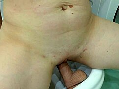 Amateur Rides Big Dildo and Films Close-Ups for Boyfriend