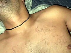 two chubby men in a gay sex scene on the bed