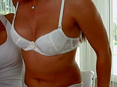 Brunettes cuddling on the couch