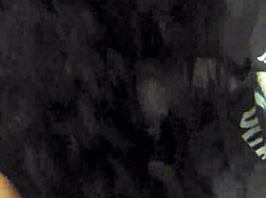 Amateur couple engages in blowjob and handjob while smoking a cigarette in the chair