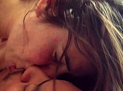 Couple engages in passionate kissing and ball sucking