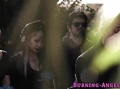 This goth girl is fucking and sucking a big cock outdoors, embracing that punk alternative vibe.