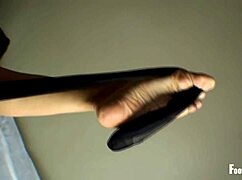 jade vixen peels off her black stockings, revealing wrinkled feet and toes