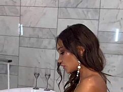 monika fox plays with pink toy in bathroom