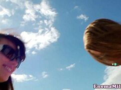 Bizarre enema fetish babes enjoy rimming on the beach