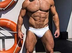 muscular bodybuilder trainer shows off monster cock in gay session