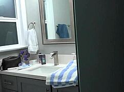 Brunette model dries off after wet shower