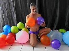 richard lennox, horny gay dilf, indulges in balloon play with monster cock.
