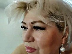 Aimee, the hot MILF, rides a toy with her shaved lips up close.