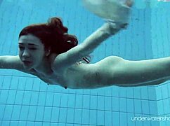 Roxalana Cheh Poses As Sexy Redhead Underwater
