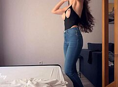 My one-night stand ends with cum on her stomach. Brunette bent over in jeans.