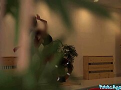 public agent brunette risks blowjob at indoor pool