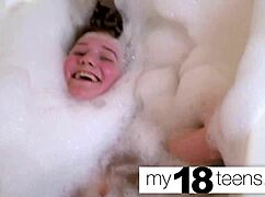 Cute redhead teen masturbates to orgasm in the bath closeup