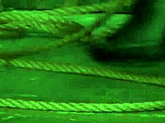 girl strips teasingly inside the cage with clothes ripping