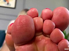 Goddess teases you with pink oily soles and toes, spreading close up