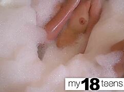 Cute redhead teen masturbates to orgasm in the bath closeup