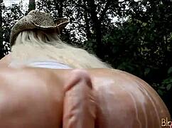 Ever Seen a Cowgirl Ride a Huge Dildo Oiled Up in the Forest?
