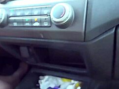 Brunette drives stick barefoot in public car. Outdoor feet fetish.