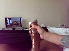 Discover this tattooed couple's homemade handjob on monster cock from POV